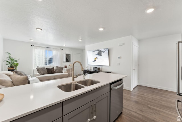 1099 E Quarterdeck Way, Saratoga Springs, UT 84045 - kitchen with a sink, gray cabinetry, light countertops, dishwasher, and wood finished floors