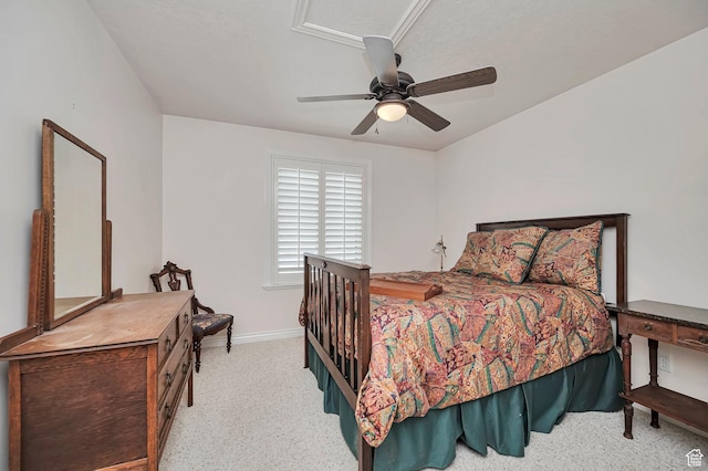 carpeted bedroom with a ceiling fan and baseboards