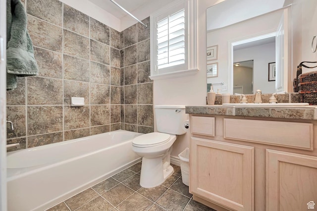 full bath featuring toilet, tile patterned floors, tub / shower combination, and vanity
