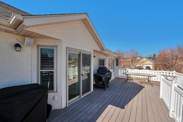 wooden terrace featuring area for grilling