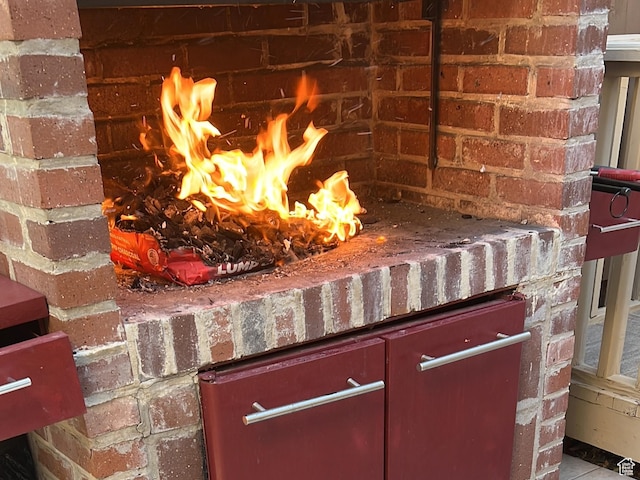 4520 S Countrylane Rd E, Millcreek, UT 84117 - detailed view of a fireplace and brick siding