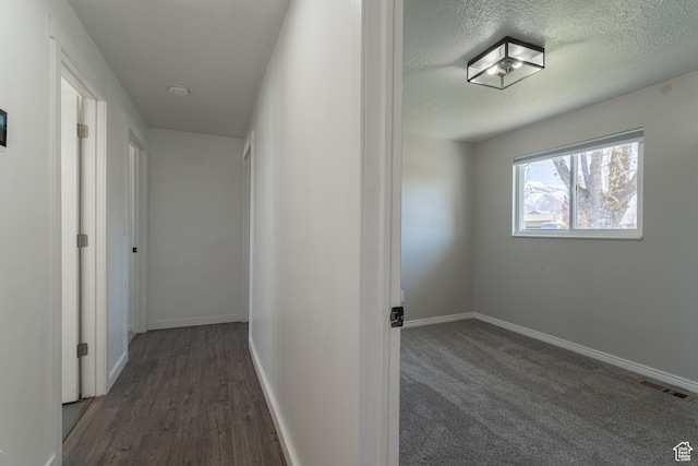 481 E Laurelwood Dr S, Kaysville, UT 84037 - hallway featuring a textured ceiling, baseboards, and visible vents