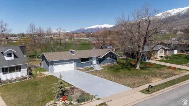 481 E Laurelwood Dr S, Kaysville, UT 84037 - ranch-style home featuring a garage, concrete driveway, a front yard, roof with shingles, and a mountain view