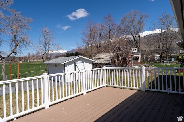 481 E Laurelwood Dr S, Kaysville, UT 84037 - deck with an outbuilding, a mountain view, and a yard