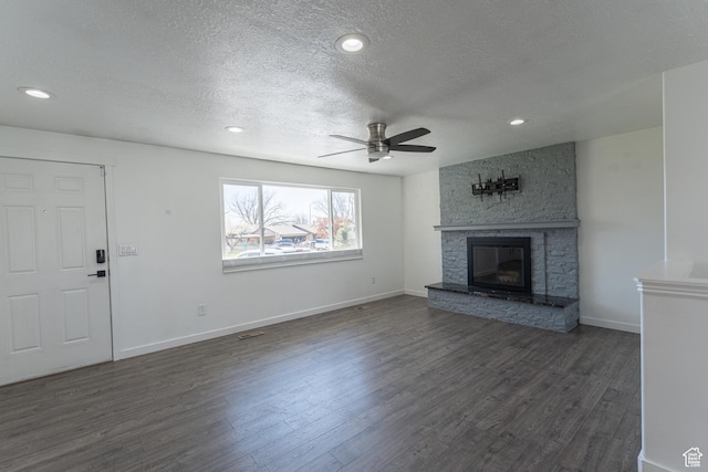 481 E Laurelwood Dr S, Kaysville, UT 84037 - unfurnished living room with dark wood-type flooring, ceiling fan, baseboards, and a fireplace