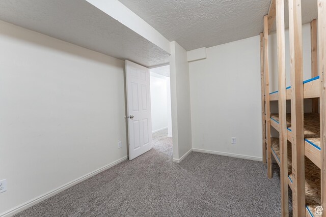 481 E Laurelwood Dr S, Kaysville, UT 84037 - finished below grade area with carpet, baseboards, and a textured ceiling