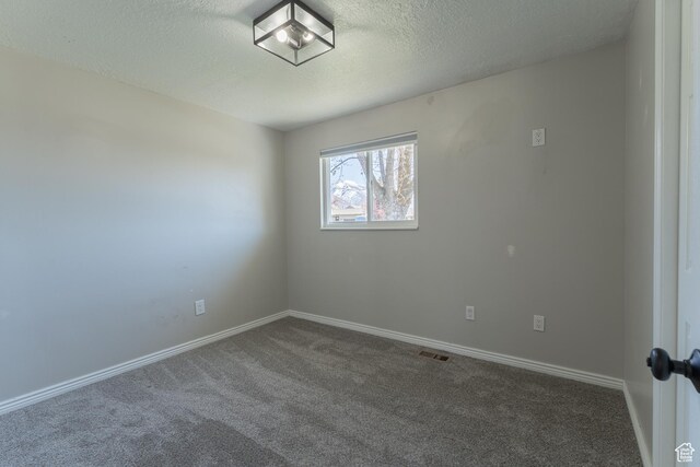 481 E Laurelwood Dr S, Kaysville, UT 84037 - carpeted spare room featuring a textured ceiling, baseboards, and visible vents