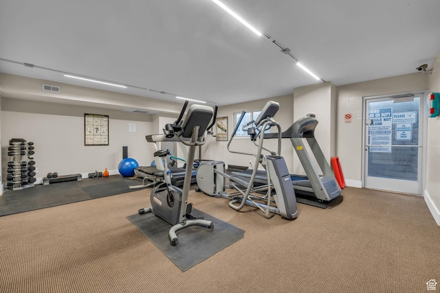 workout area featuring visible vents and baseboards
