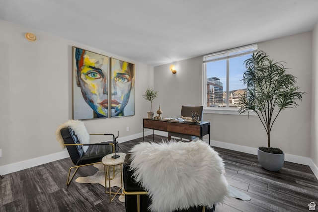 office area with baseboards and wood finished floors
