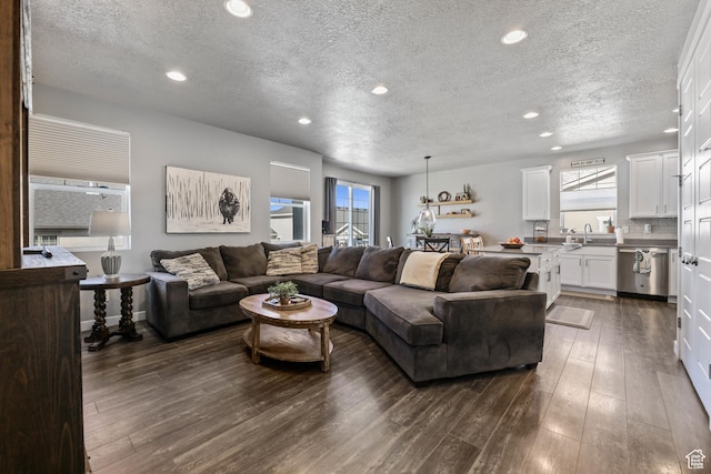 1879 N 925 E, North Ogden, UT 84414 - living room featuring a textured ceiling, healthy amount of natural light, dark wood finished floors, and recessed lighting
