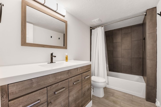 1879 N 925 E, North Ogden, UT 84414 - bathroom with toilet, vanity, a textured ceiling, shower / tub combo with curtain, and wood finished floors