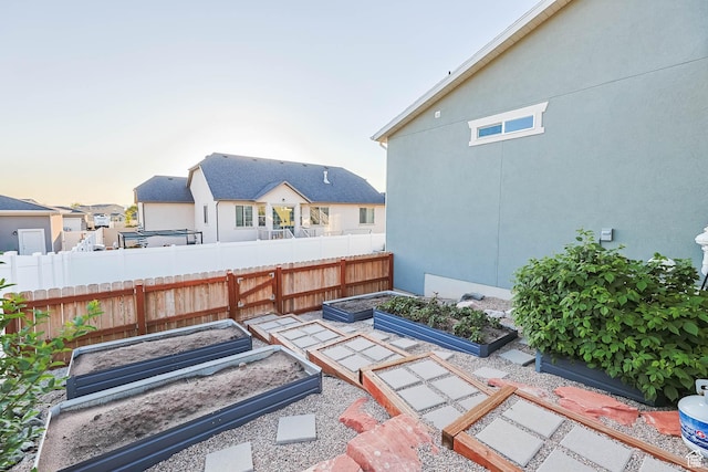 1879 N 925 E, North Ogden, UT 84414 - yard at dusk featuring a vegetable garden