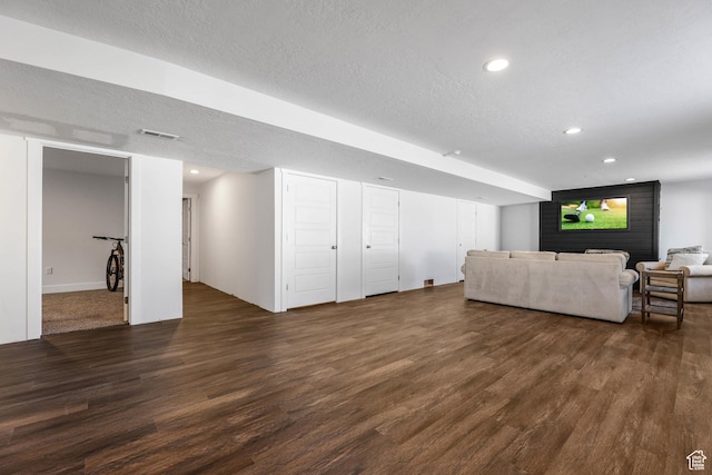 1879 N 925 E, North Ogden, UT 84414 - living area featuring dark wood-type flooring, a textured ceiling, and recessed lighting