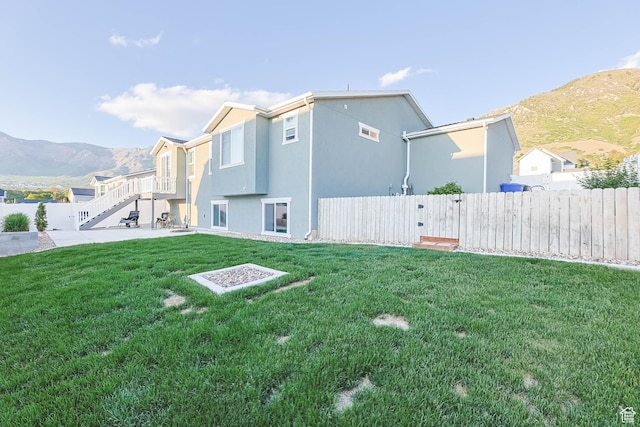 1879 N 925 E, North Ogden, UT 84414 - back of property with stucco siding, a mountain view, and stairs