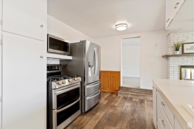 405 W 5100 S, Washington Terrace, UT 84405 - kitchen featuring a wainscoted wall, light countertops, stainless steel appliances, dark wood-style floors, and white cabinetry