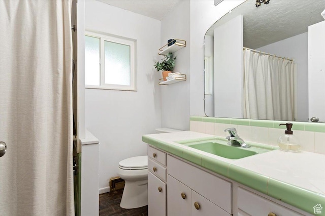 405 W 5100 S, Washington Terrace, UT 84405 - bathroom with baseboards, toilet, vanity, wood finished floors, and a textured ceiling
