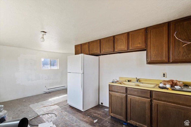 405 W 5100 S, Washington Terrace, UT 84405 - kitchen featuring a sink, a baseboard heating unit, light countertops, and freestanding refrigerator