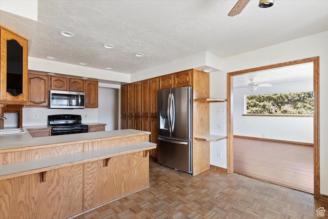 445 W 5100 S, Washington Terrace, UT 84405 - kitchen featuring a sink, a textured ceiling, appliances with stainless steel finishes, light countertops, and ceiling fan