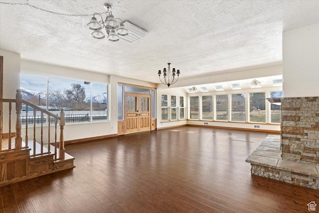 445 W 5100 S, Washington Terrace, UT 84405 - unfurnished living room featuring a chandelier, plenty of natural light, and wood-type flooring