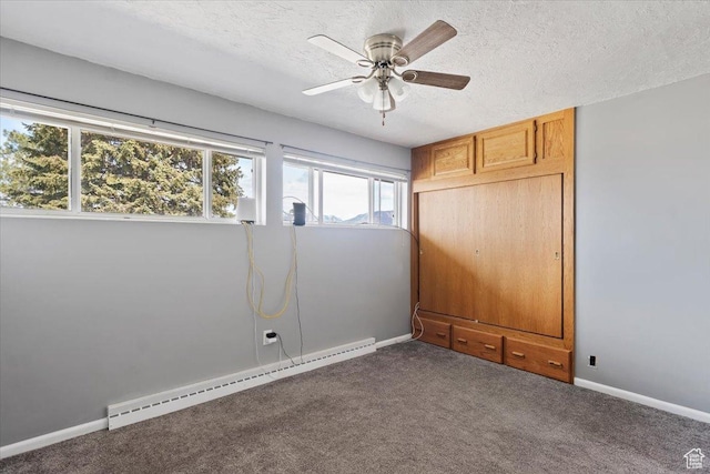 445 W 5100 S, Washington Terrace, UT 84405 - spare room with baseboards, a baseboard radiator, ceiling fan, a textured ceiling, and dark carpet