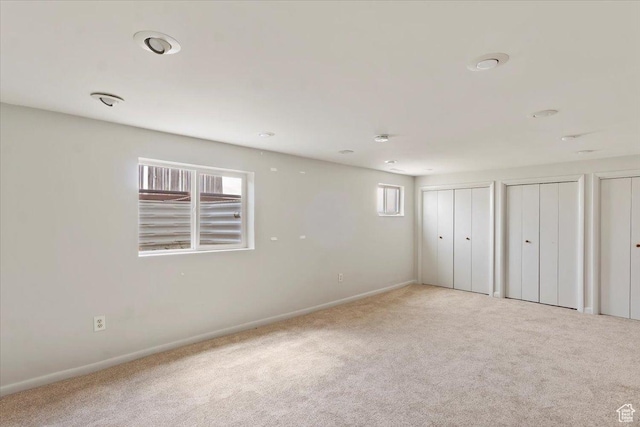 445 W 5100 S, Washington Terrace, UT 84405 - unfurnished bedroom with multiple windows, baseboards, multiple closets, and carpet floors
