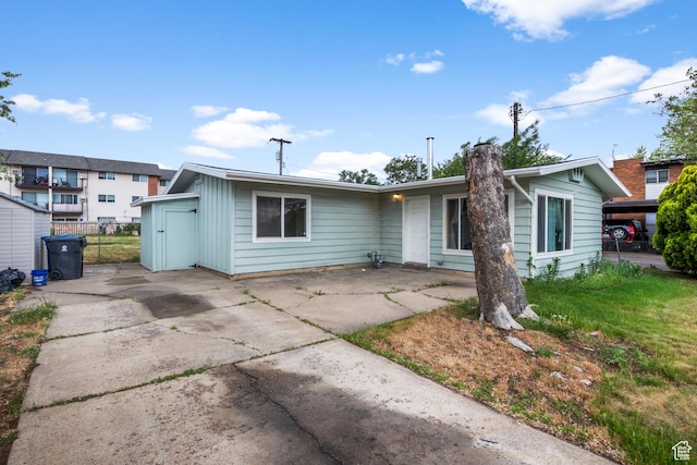 435 W 4800 S, Washington Terrace, UT 84405 - view of front of house with concrete driveway, fence, and a patio