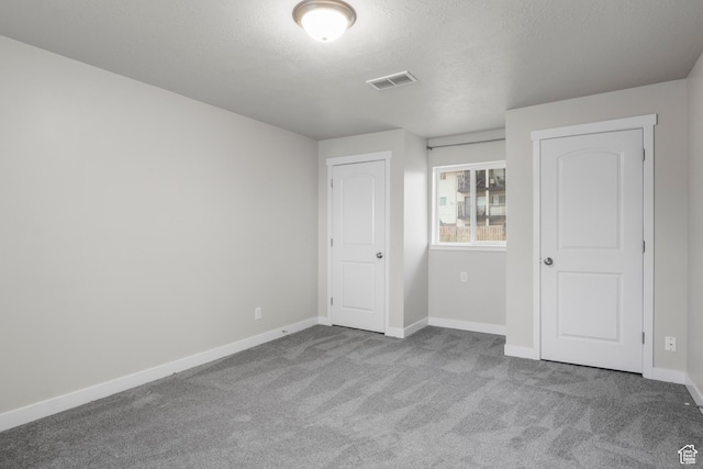 435 W 4800 S, Washington Terrace, UT 84405 - unfurnished bedroom featuring carpet, baseboards, and a textured ceiling