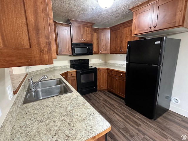 1045 S 1700 W Unit 1121, Payson, UT 84651 - kitchen featuring light countertops, dark wood-type flooring, a sink, a textured ceiling, and black appliances