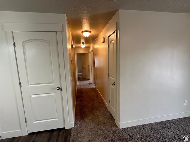 1045 S 1700 W Unit 1121, Payson, UT 84651 - corridor with baseboards, dark colored carpet, and a textured ceiling