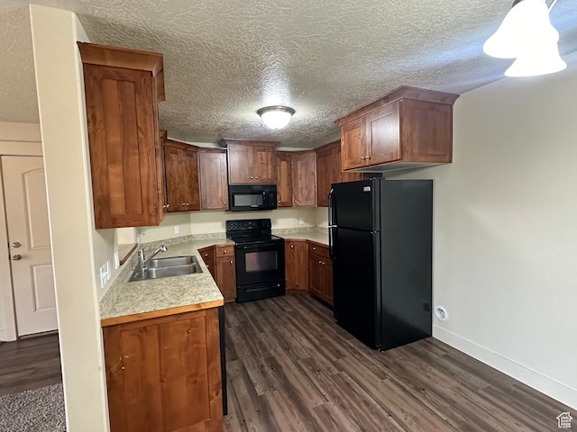 1045 S 1700 W Unit 1121, Payson, UT 84651 - kitchen with dark wood-style flooring, light countertops, a sink, a textured ceiling, and black appliances