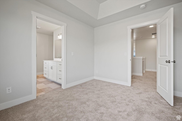 635 S 85 E Unit 26, Smithfield, UT 84335 - unfurnished bedroom featuring light colored carpet, connected bathroom, and baseboards