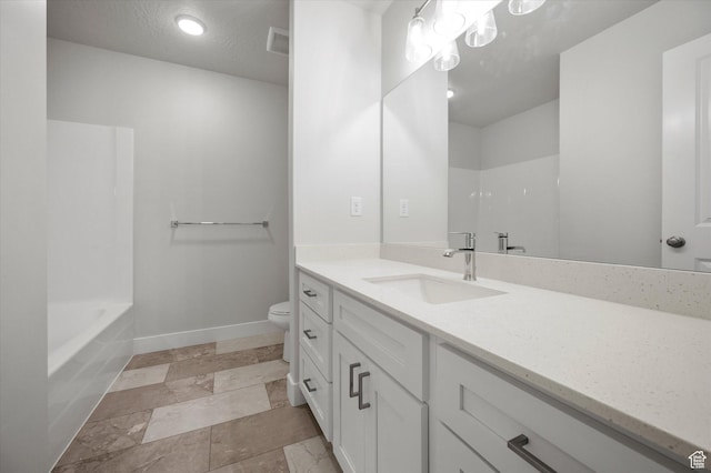 635 S 85 E Unit 26, Smithfield, UT 84335 - full bathroom with visible vents, toilet, a textured ceiling, baseboards, and vanity