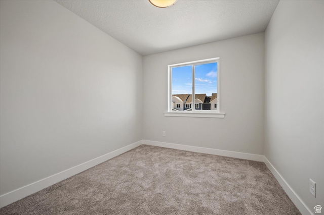 635 S 85 E Unit 26, Smithfield, UT 84335 - spare room with carpet flooring, a textured ceiling, and baseboards