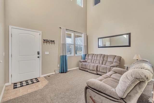 1114 Alexander Ct, Grantsville, UT 84029 - tiled living area with a towering ceiling, baseboards, visible vents, and carpet flooring