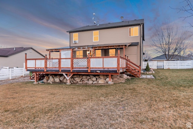 1114 Alexander Ct, Grantsville, UT 84029 - back of property with a fenced backyard, a wooden deck, and a yard