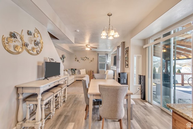 1114 Alexander Ct, Grantsville, UT 84029 - dining room featuring ceiling fan with notable chandelier and light wood-style floors