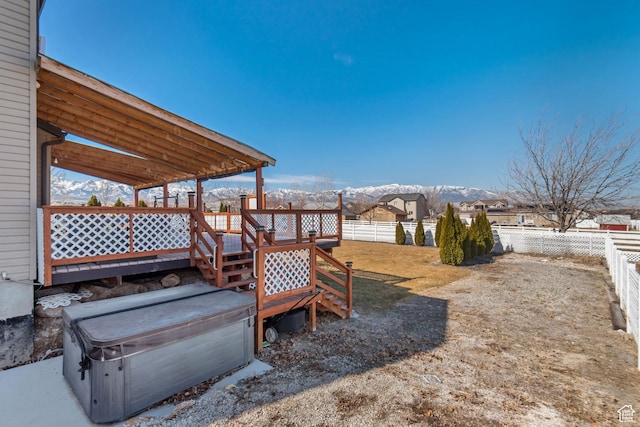 1114 Alexander Ct, Grantsville, UT 84029 - view of yard with a deck with mountain view and a fenced backyard