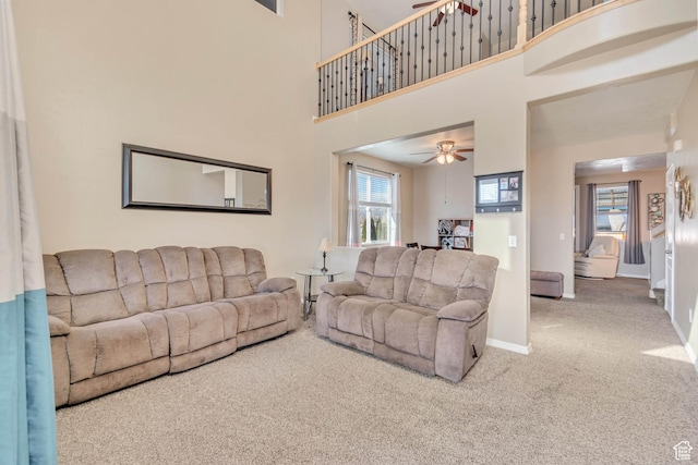 1114 Alexander Ct, Grantsville, UT 84029 - living area with a healthy amount of sunlight, carpet, baseboards, and a ceiling fan