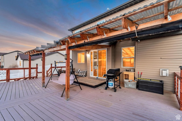 1114 Alexander Ct, Grantsville, UT 84029 - deck at dusk with grilling area and a pergola