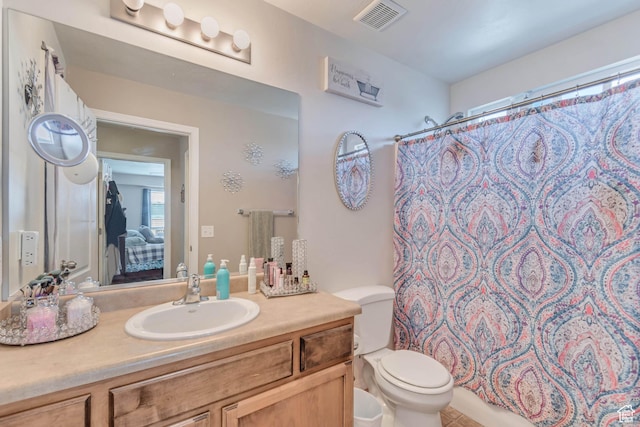 1114 Alexander Ct, Grantsville, UT 84029 - bathroom with toilet, a shower with shower curtain, vanity, and visible vents