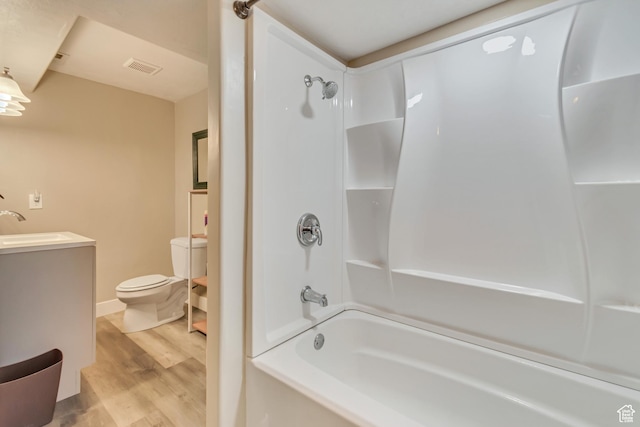 1114 Alexander Ct, Grantsville, UT 84029 - bathroom with bathtub / shower combination, toilet, wood finished floors, visible vents, and vanity