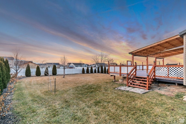 1114 Alexander Ct, Grantsville, UT 84029 - yard at dusk featuring fence and a deck