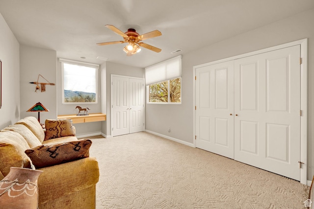 1657 N Kayenta Dr, Ivins, UT 84738 - living area featuring ceiling fan, baseboards, and carpet