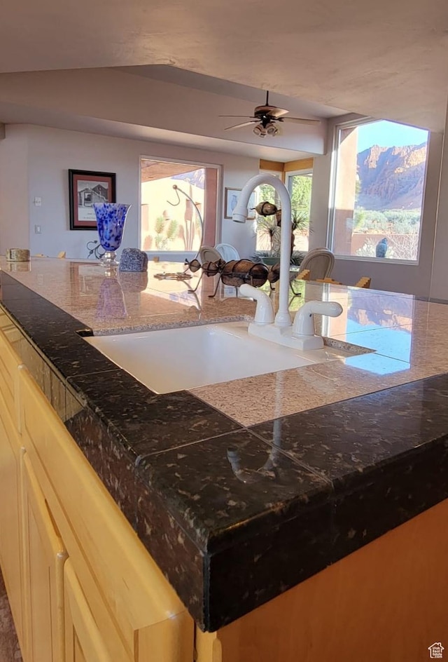 1657 N Kayenta Dr, Ivins, UT 84738 - kitchen view of a sink, stone countertops, and ceiling fan