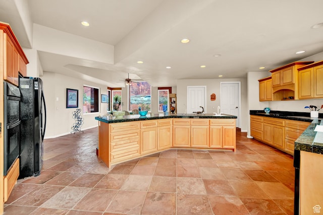 1657 N Kayenta Dr, Ivins, UT 84738 - kitchen featuring recessed lighting, black appliances, a ceiling fan, dark countertops, and light stone finish floors