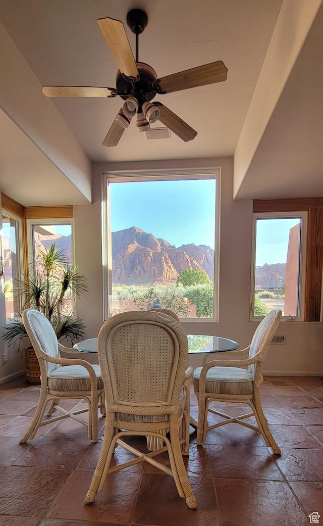 1657 N Kayenta Dr, Ivins, UT 84738 - dining room with stone tile flooring, ceiling fan, and a mountain view