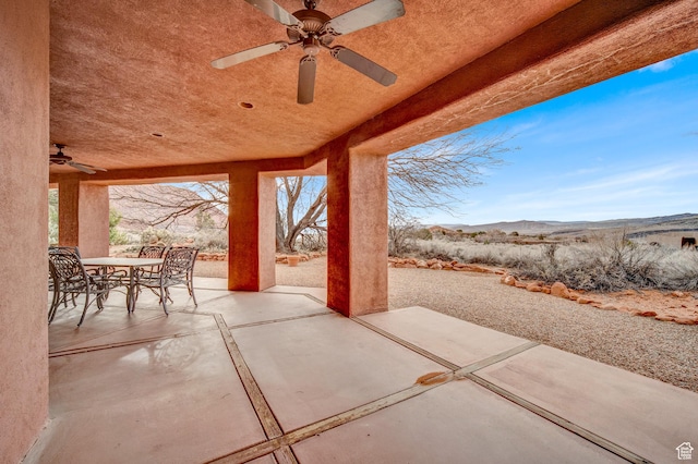 1657 N Kayenta Dr, Ivins, UT 84738 - view of patio / terrace with a ceiling fan, outdoor dining space, and a mountain view