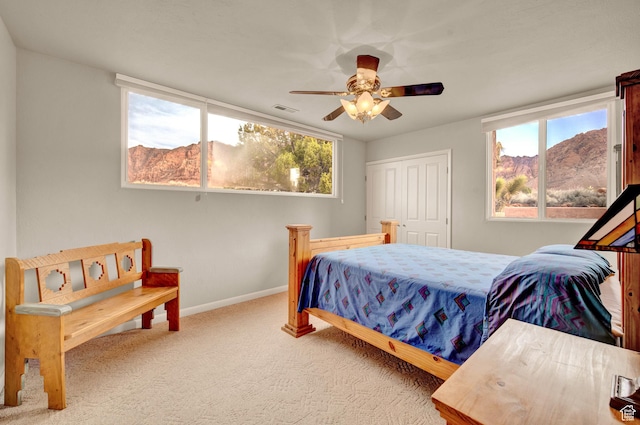 1657 N Kayenta Dr, Ivins, UT 84738 - bedroom featuring carpet floors, ceiling fan, baseboards, and a closet