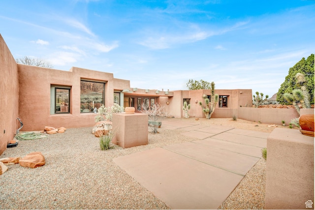 1657 N Kayenta Dr, Ivins, UT 84738 - rear view of house featuring stucco siding and a patio