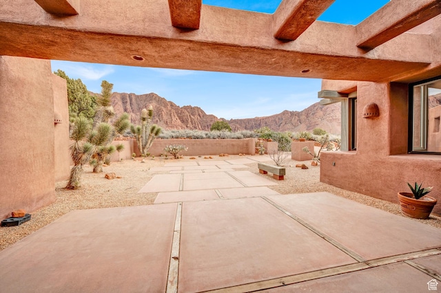 1657 N Kayenta Dr, Ivins, UT 84738 - fenced backyard with a mountain view and a patio